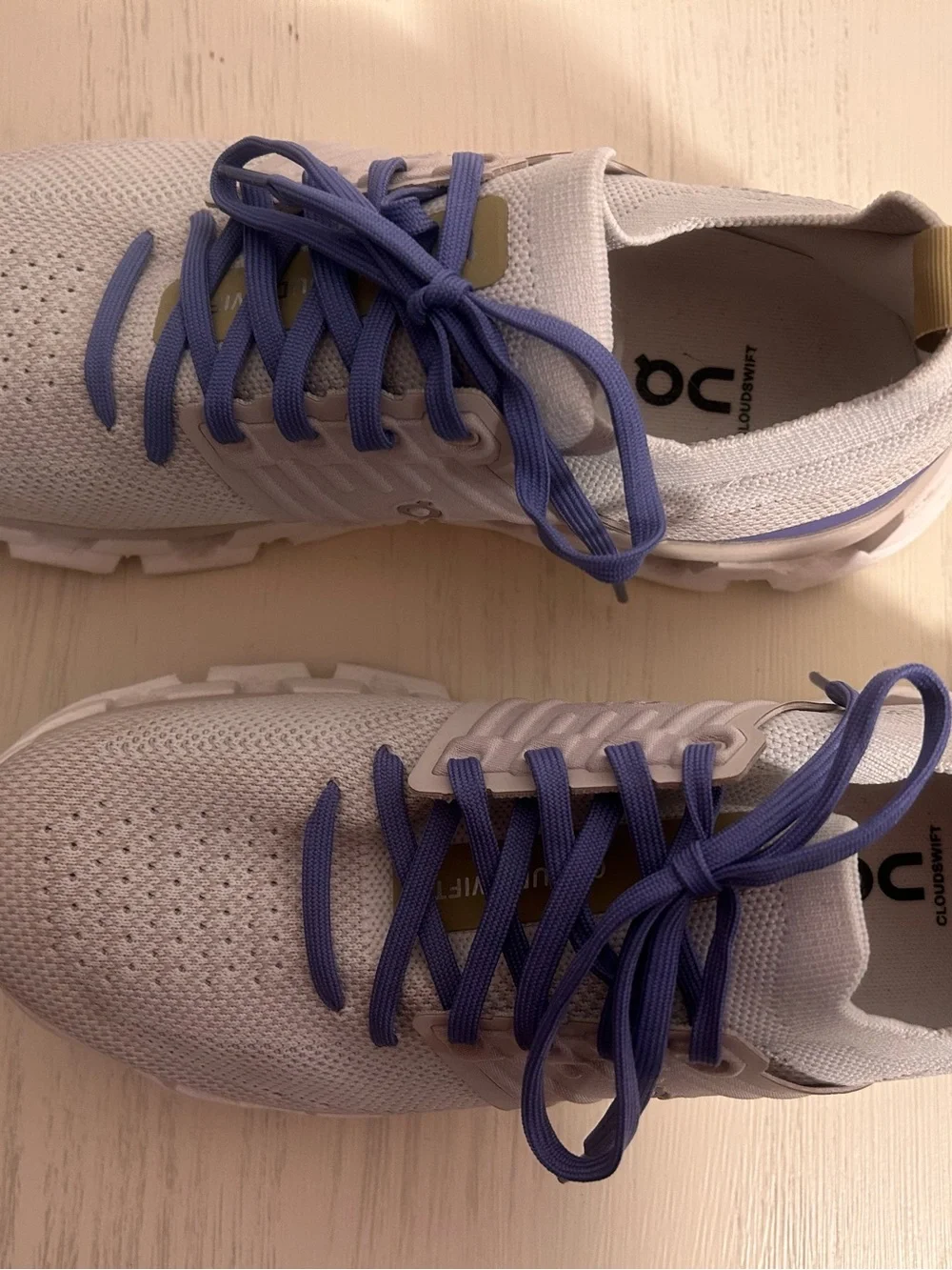 On Running Women’s Sneakers in Light Gray/White with Purple Laces